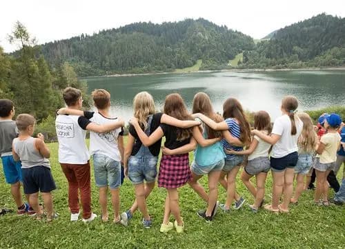 Children with their arms around each other