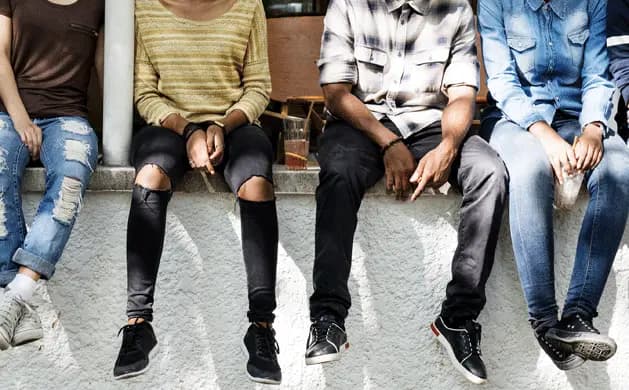 Children sitting on wall
