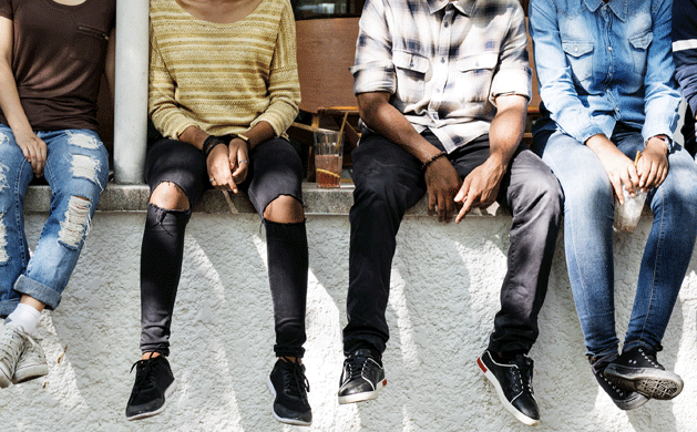 Children sitting on a wall